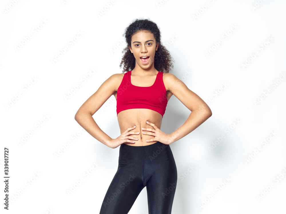 Obraz premium young sporty woman with a dumbbell
