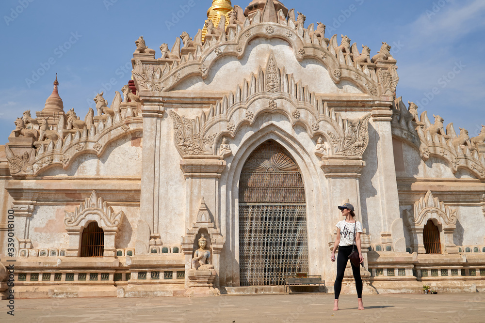 A woman traveller in the Ananda Temple in the old Bagan, vacation in Myanmar, Burma.