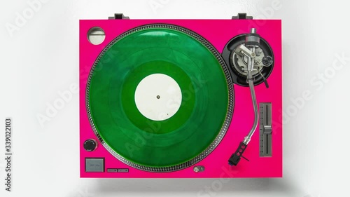 Animation of records stacked on vintage record player.