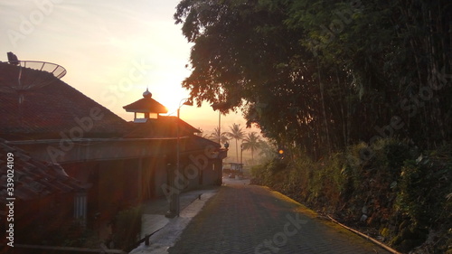 Sunrise in the countryside in Central Java Indonesia. people's homes, village roads and sunny sunshine