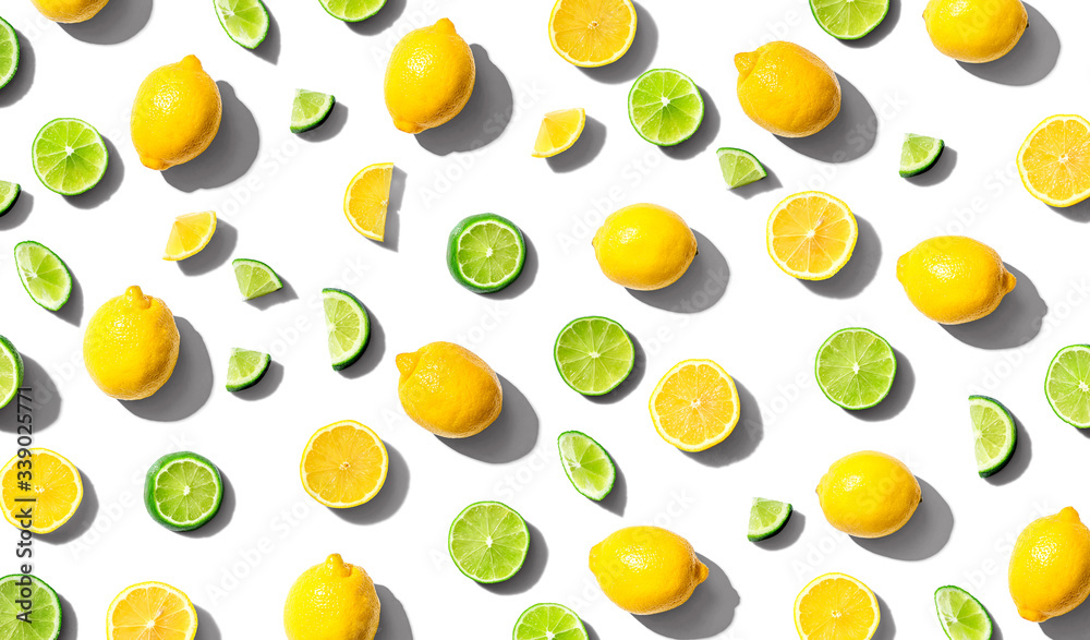 Fresh lemons and limes overhead view - flat lay Fresh lemons and limes overhead view - flat lay