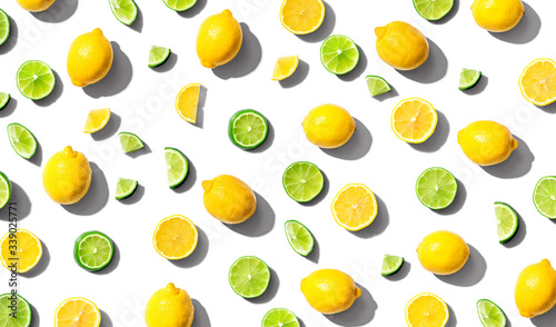 Fresh lemons and limes overhead view - flat lay