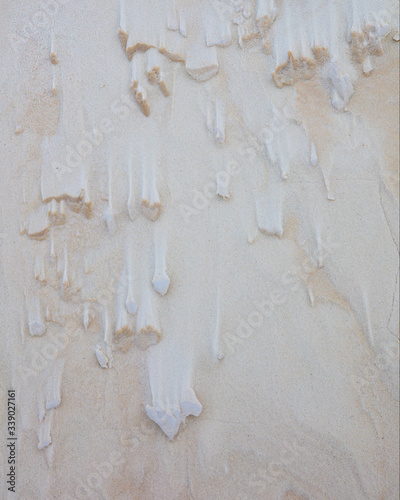 Minimalist Landscape Image of Wind Erosion Structures on a White Sand Dune photo