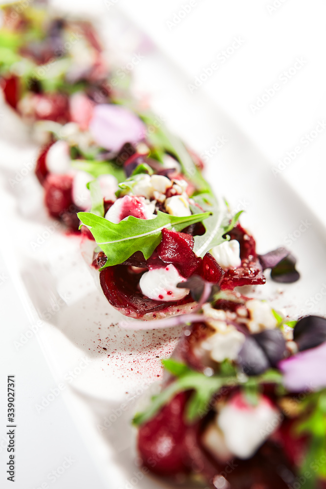 Beetroot tartare with goat cheese on tray