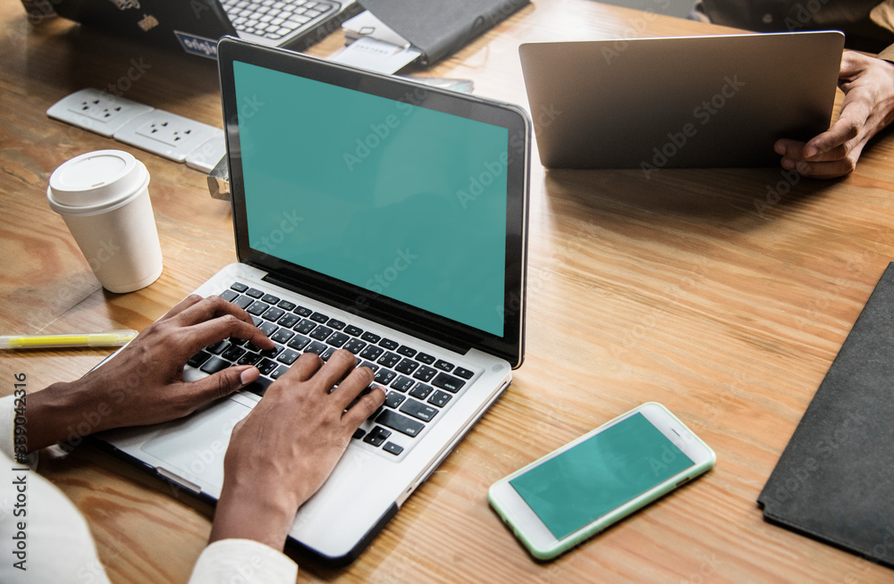 People working on a laptop in a meeting