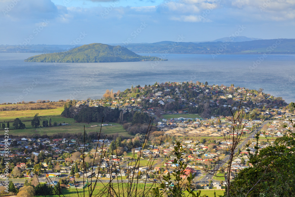 View of part of Rotorua, New Zealand, from Mount Ngongotaha. In the foreground are the suburbs of Fairy Springs and Kawaha Point, with Lake Rotorua and Mokoia Island in the background