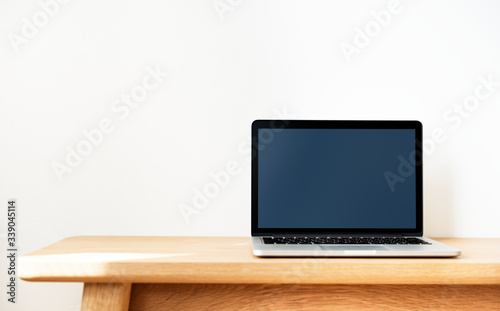 Laptop on a wooden table