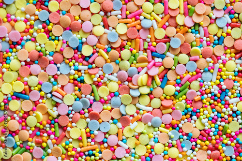 Colorful confetti sprinkles textured background