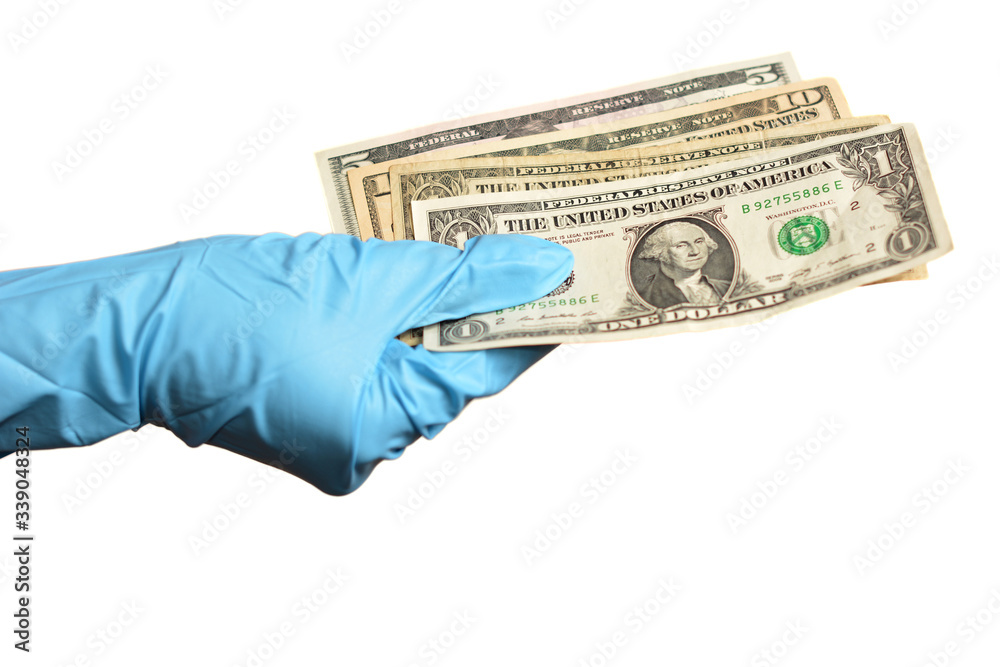 Hand in blue protective gloves with money isolated on white background.  Stock Photo | Adobe Stock