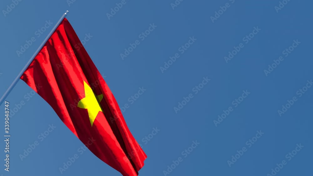 The national flag of Vietnam is flying in the wind