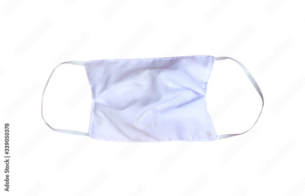 Dirty white fabric mask with rubber ear straps isolated on  background and clipping path