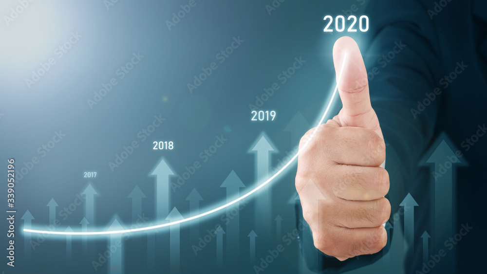 Man standing and pointing hand with Arrow and Line Visual Graphic on Light of Len flare and Boke blue background. COPY SPACE. Business Concept : Market Uptrend. Man standing and pointing hand with Arrow and Line Visual Graphic on Light of Len flare and Boke blue background. COPY SPACE. Business Concept : Market Uptrend.