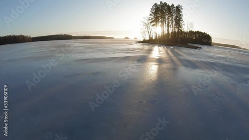 Pov view of skating on ice of a frozen lake photo