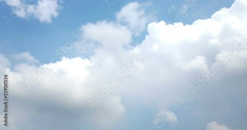 Timelapse of clouds moving on blue sky