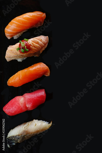 Closeup of fresh sushi on on ceramic dish, Japanese food                               