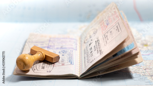 Italian passport pages with a lot of visa stamps.