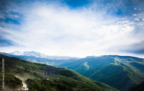 Fototapeta Naklejka Na Ścianę i Meble -  Mountains rocks a relief a landscape a hill a panorama Caucasus top a slope clouds the sky a landscape