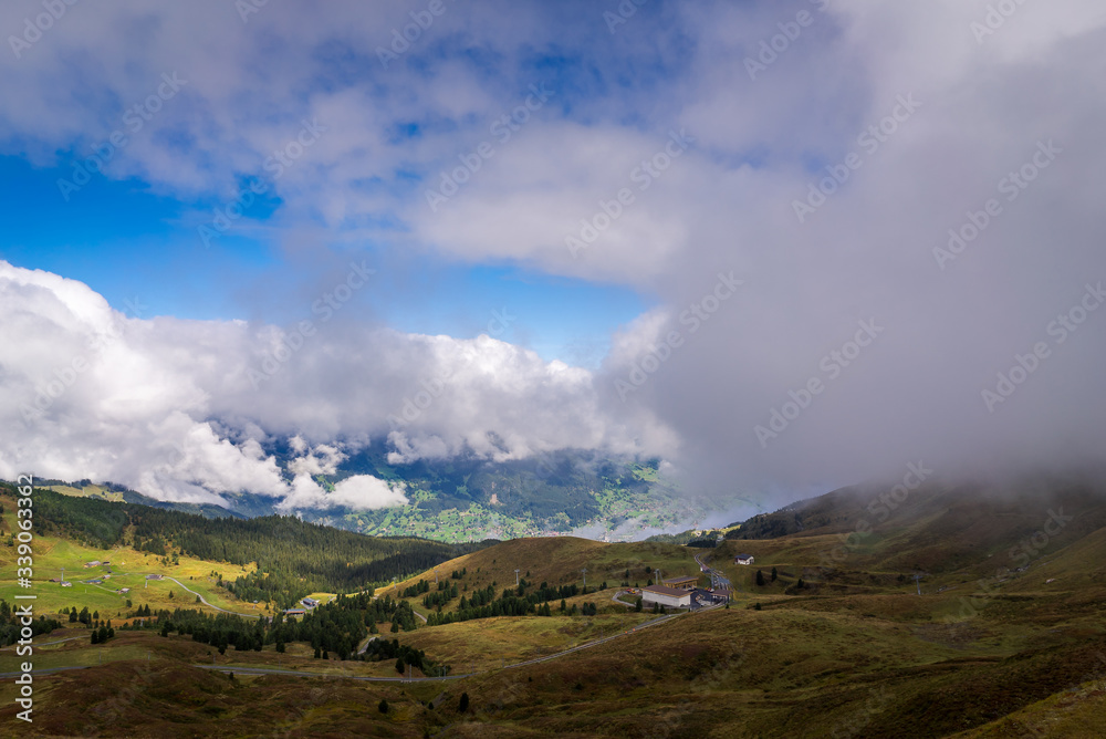 Overlooking a mountain valley landscape in Kleine Scheidegg in the alpine region of Grindelwald, Switzerland