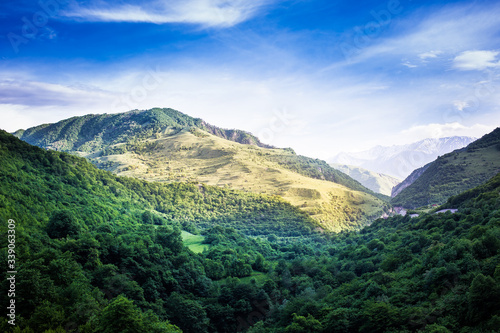 Mountains rocks a relief a landscape a hill a panorama Caucasus top a slope clouds the sky a landscape