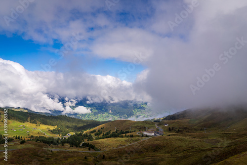 Overlooking a mountain valley landscape in Kleine Scheidegg in the alpine region of Grindelwald, Switzerland