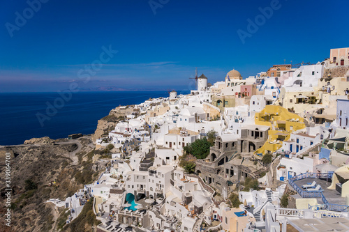 Overlooking the town of Oia on the edge of the beautiful Caldera ocean on the island of Santorini, Greece