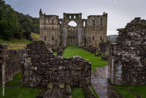 Looking into the ruined historic Rievaulx Abbey on a rainy day in North Yorkshire, United Kingdom