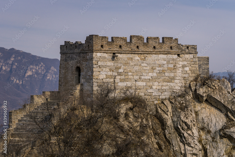 The Great Wall tower built upon a rocky cliff, high up in the mountains of Jiankou, China