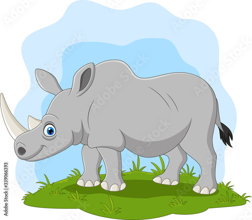 Cartoon happy rhino on the grass