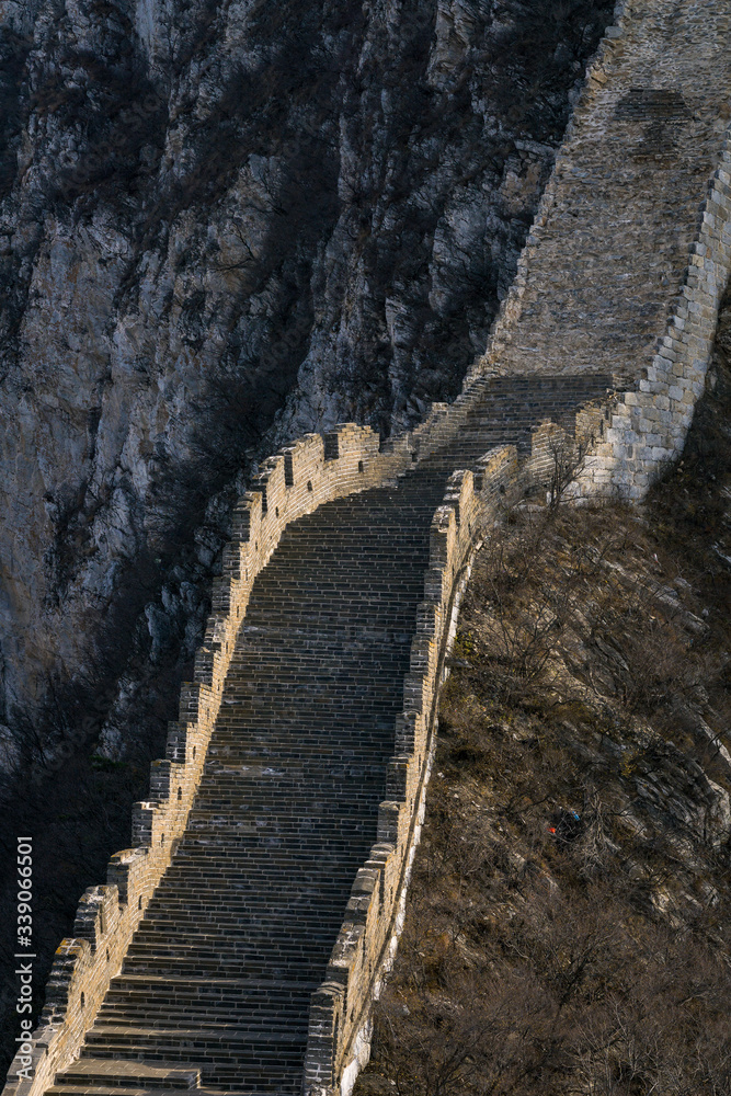 Ruined part of the Great Wall of China winding along the mountains of Jiankou, China