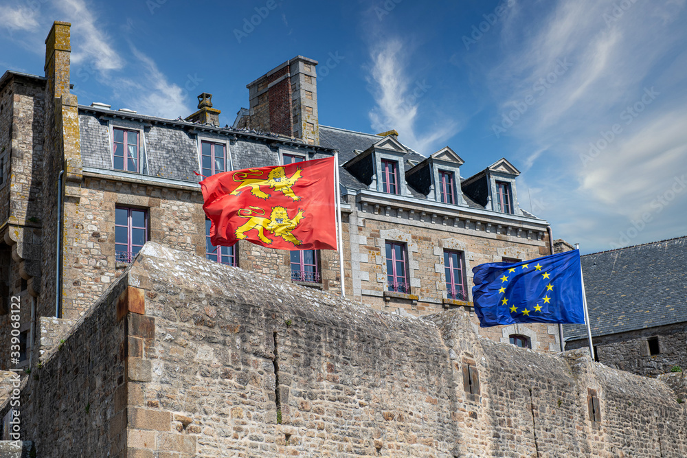Norman and European flags on the ramparts of Saint Malo, France - obrazy, fototapety, plakaty 