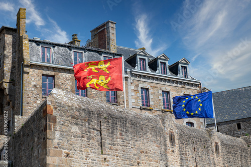 Norman and European flags on the ramparts of Saint Malo, France