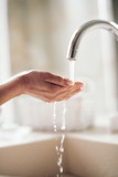 Close up	of woman wash her  hands.