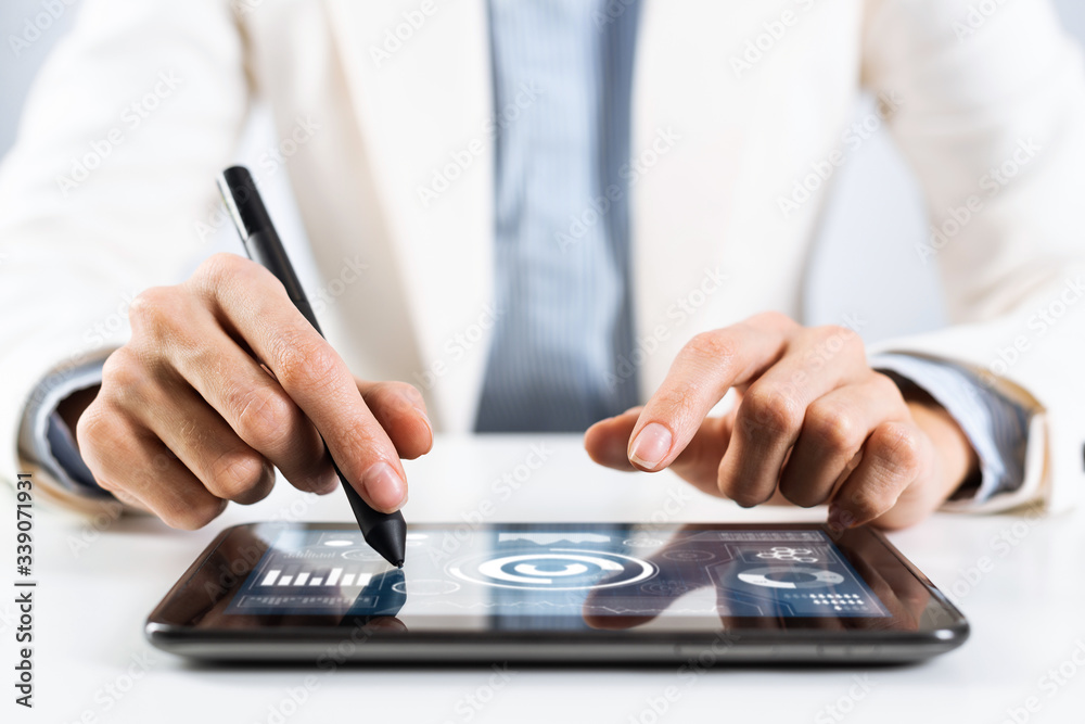Man in business suit using tablet computer Man in business suit using tablet computer