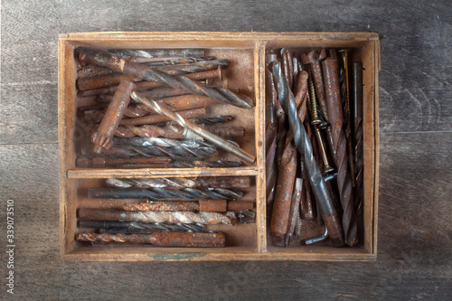 wooden box of used drills