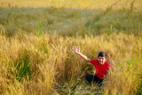young indian child playing at wheat field, Rural india