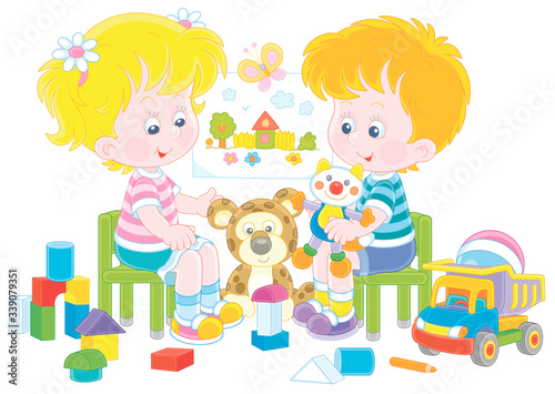 Cheerful small children playing with their funny colorful toys in a nursery room, vector cartoon illustration on a white background