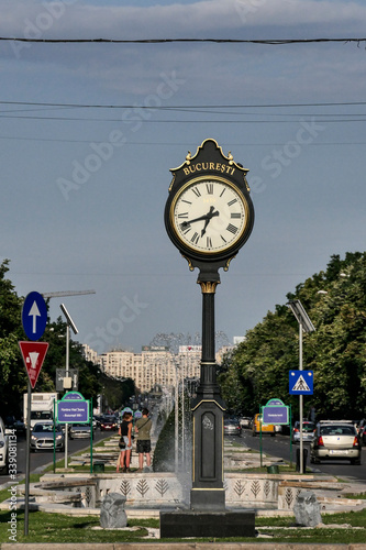 BUCHAREST, ROMANIA Boulevard Unirii and clock photo