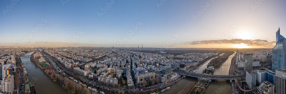 Dec 13, 2019 - Paris, France: Aerial panorama drone shot of Neuilly Levallois n Paris with Tour Eiffel Montparnasse Jardin acclimatation in Boulogne forests