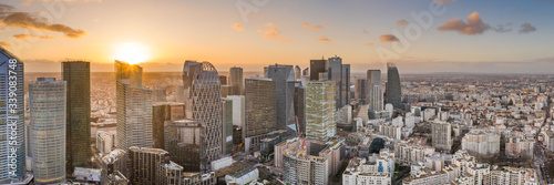 Aerial pano drone shot of La Defense skyscraper complex during sunset hours