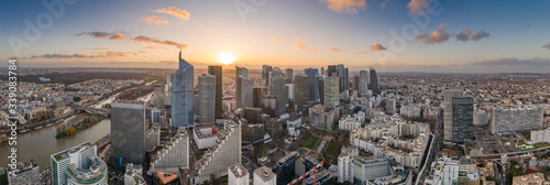Slika na platnu Aerial pano drone shot of La Defense skyscraper complex during sunset hours