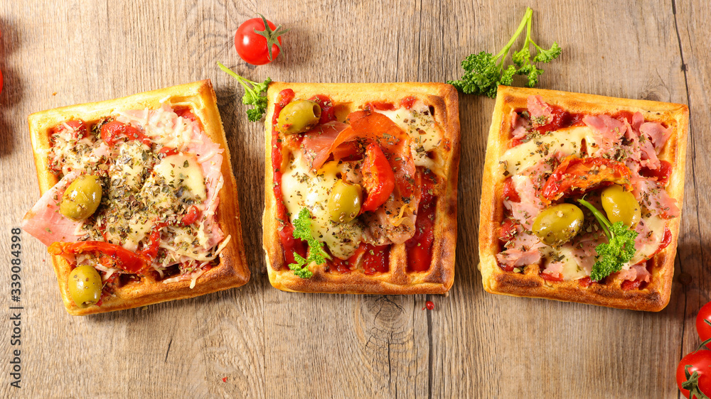 waffle pizza with tomato sauce, cheese, olive and ham