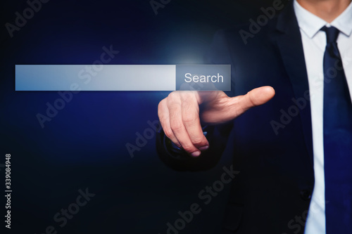Businessman using search bar on virtual screen, closeup