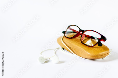 eyeglass placed on its wooden case