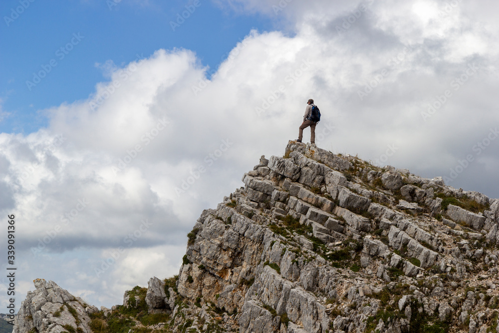 hiker on the top of a mountain aurunci