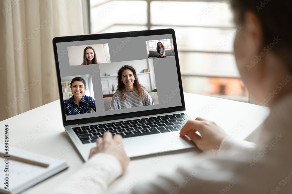 Modern tech communication application, international friendship, distant chat, easy convenient comfort usage concept, laptop screen view over woman shoulder while sit at desk and look at pc monitor