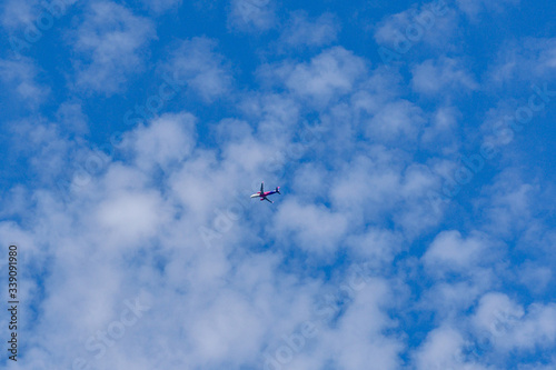 Commercial passenger airplane in the blue sky