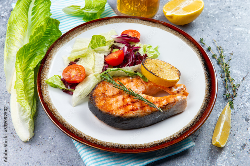 salmon steak and salad with tomatoes salmon steak and salad with tomatoes