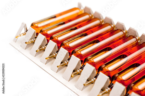 Packing of glass ampoules with a medical preparation shot on a white background.