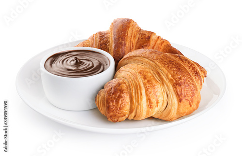 Croissants and chocolate butter on a plate isolated on white background.