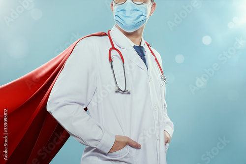 Fototapeta Closeup Doctor with mask and cape hero